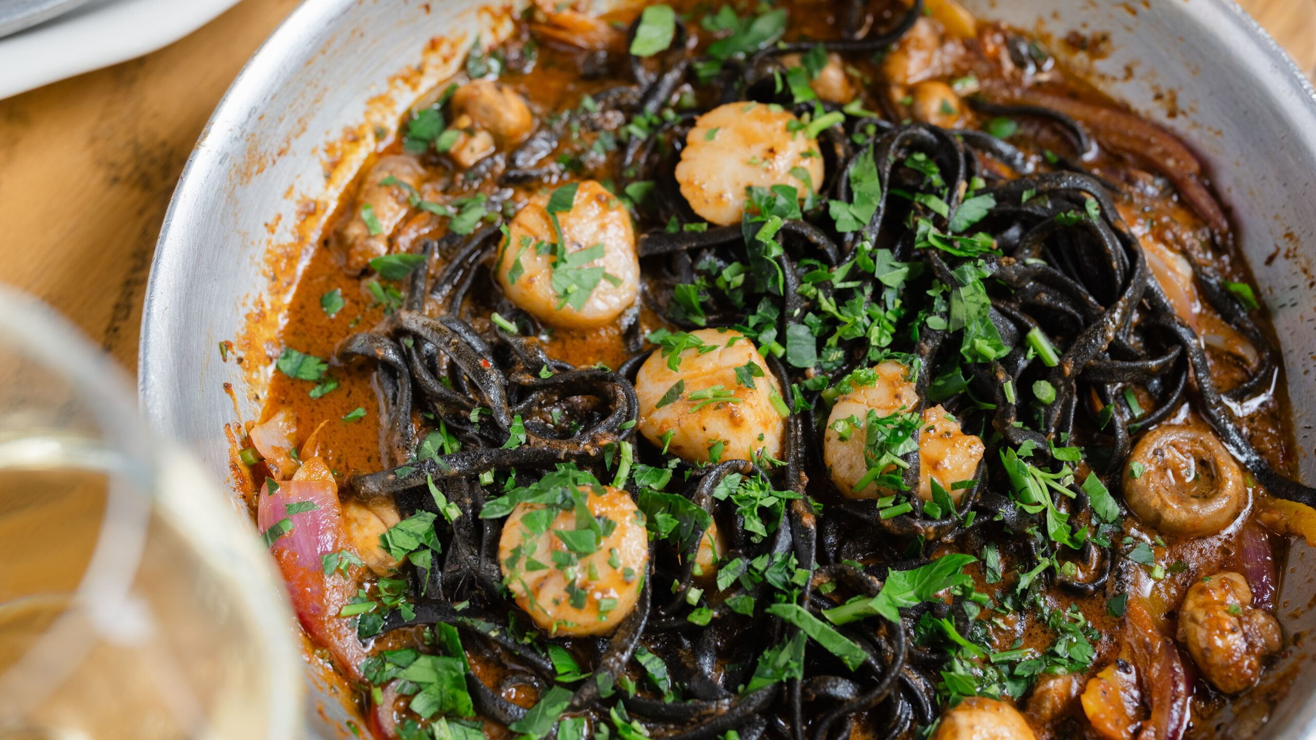 The Daily Catch – bowl of squid ink pasta with scallops, shrimp and fresh herbs.