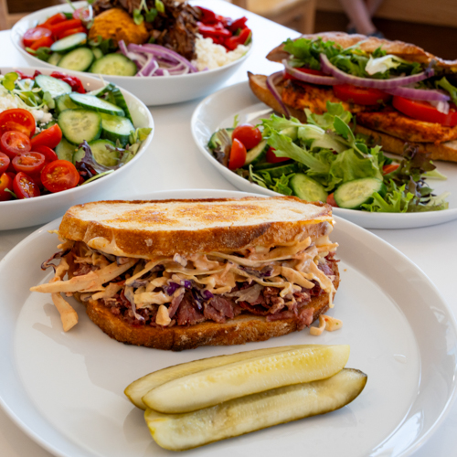 Photo of sandwiches, salads, and pickles from The Ministry of Coffee